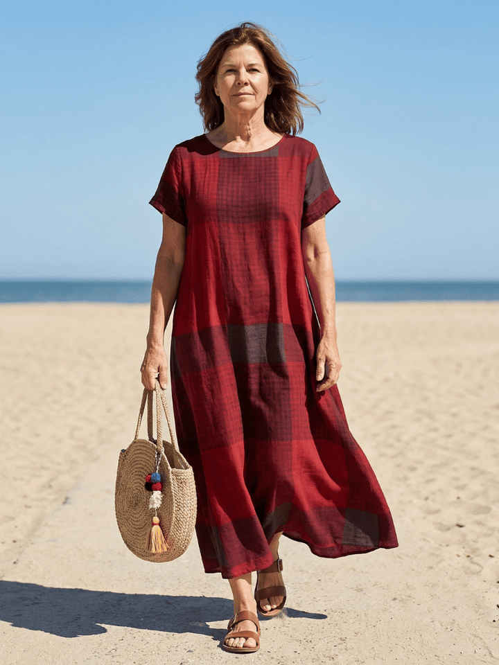 Alaia™ Relaxed Line Midi Dress by Emma & Rose Cape Town, featuring flowy fabric and a relaxed fit, shown on a model.