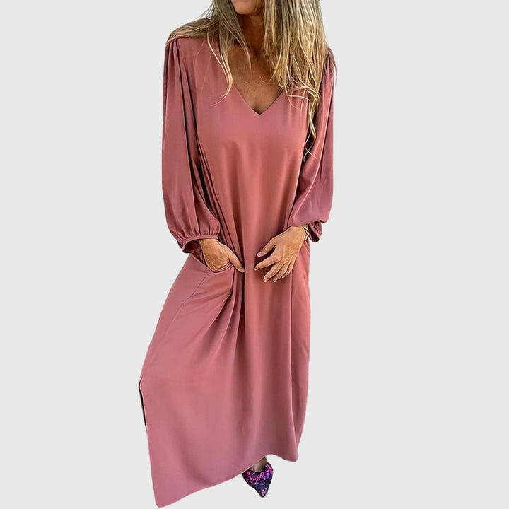Emma & Rose Cape Town Carol™ long boho dress with pockets, featuring flowing fabric and bohemian style, worn by a model outdoors