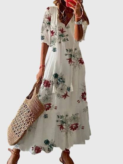 Emma & Rose Cape Town Amalia™ boho vintage summer dress with floral pattern and flowing fabric, perfect for warm weather.