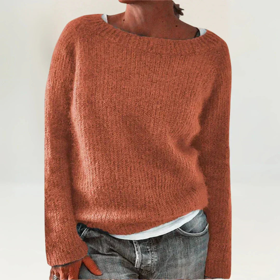Orange cozy sweater from Emma & Rose Cape Town, featuring a soft knit fabric and relaxed fit, perfect for casual wear.