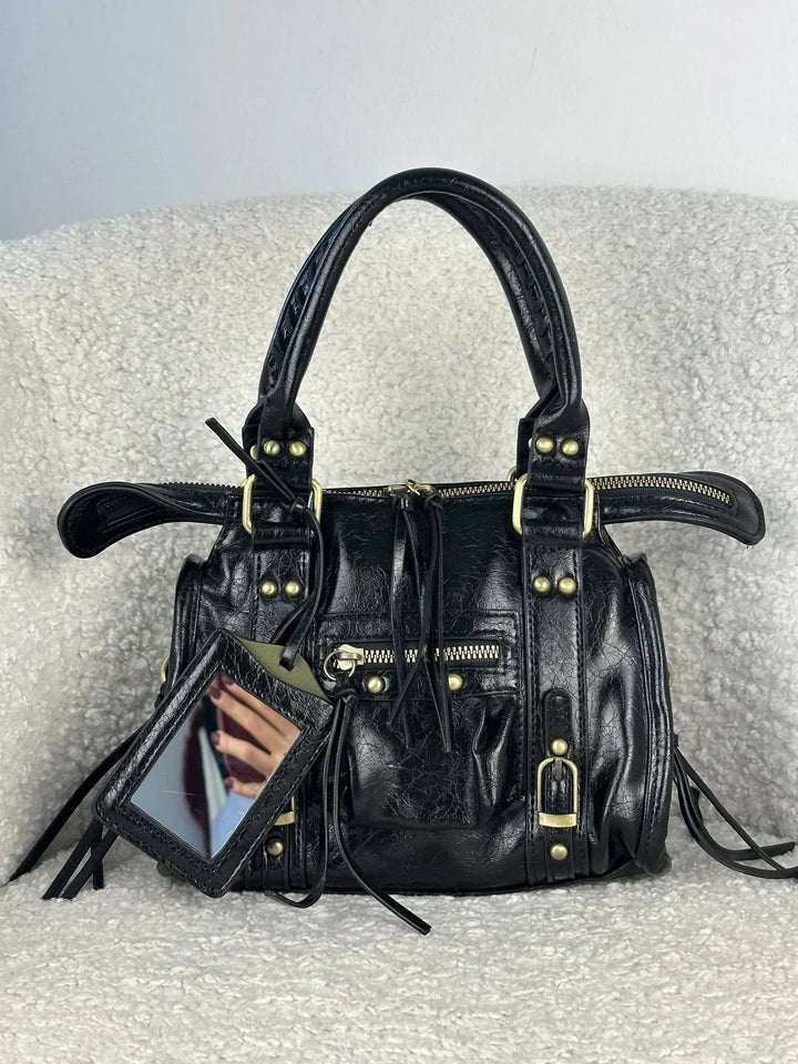 Emma & Rose Cape Town Lize™ genuine leather handbag with sleek design and top handle, showcasing its elegant craftsmanship.
