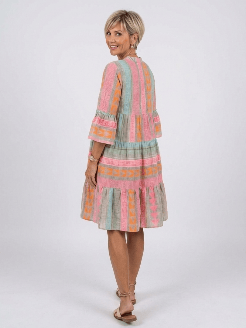Emma & Rose Cape Town Maelle™ tiered knee-length dress with ruffled layers and floral pattern, styled for casual wear.