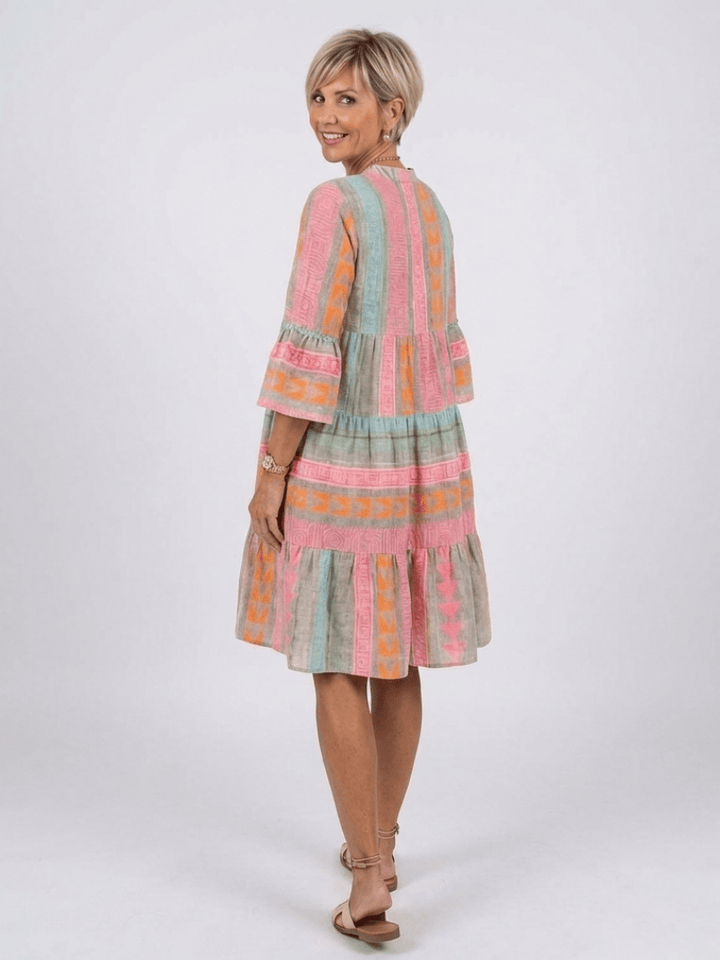 Emma & Rose Cape Town Maelle™ tiered knee-length dress with ruffled layers and floral pattern, styled for casual wear.
