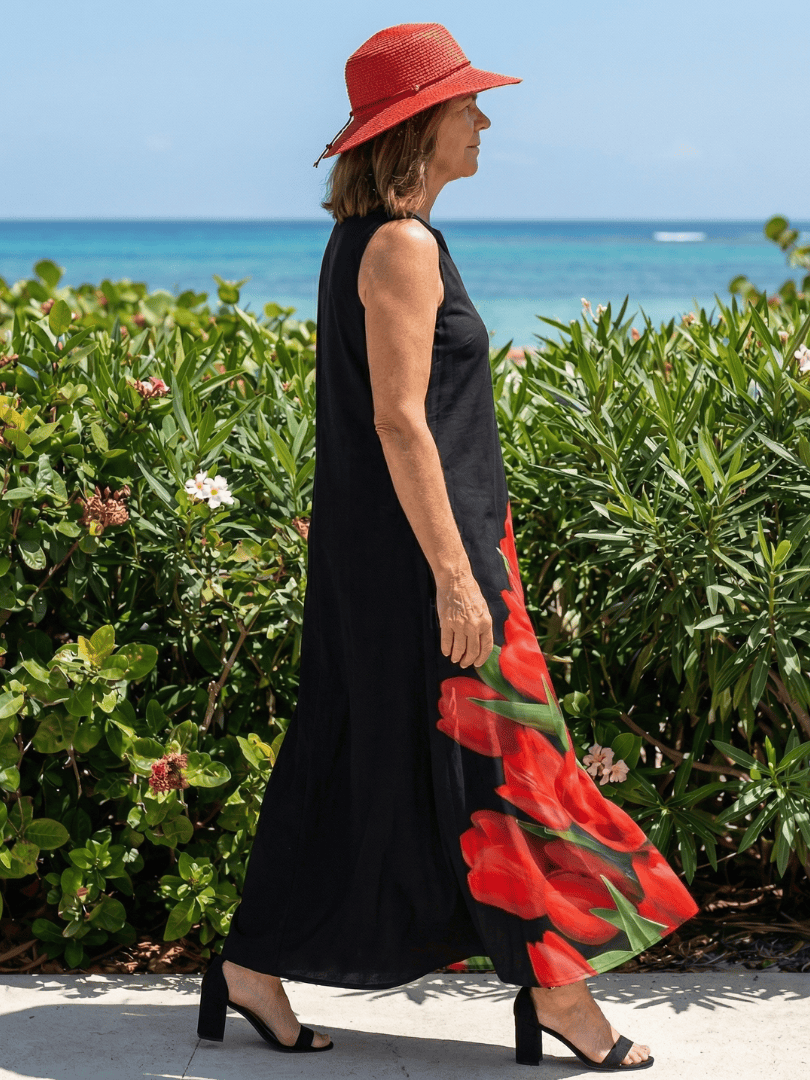 Emma & Rose Cape Town Cylia™ Soft Rose Maxi Dress featuring flowing fabric and elegant design, displayed on a hanger.