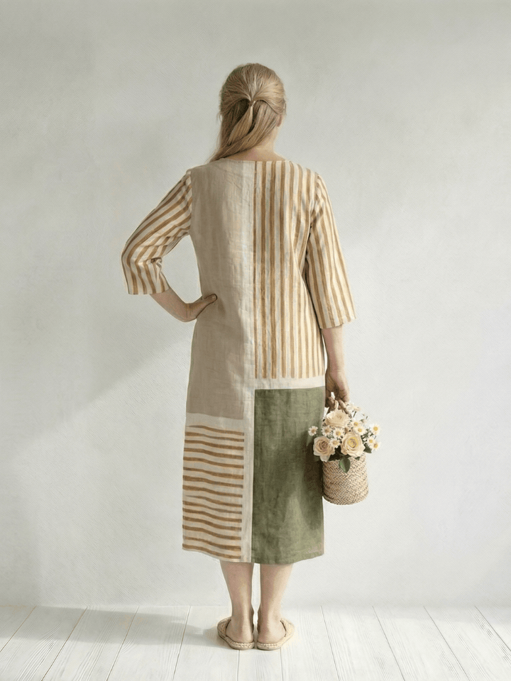 Emma & Rose Cape Town Soren™ mixed stripe midi dress with a fitted bodice and flowing skirt, displayed on a hanger.