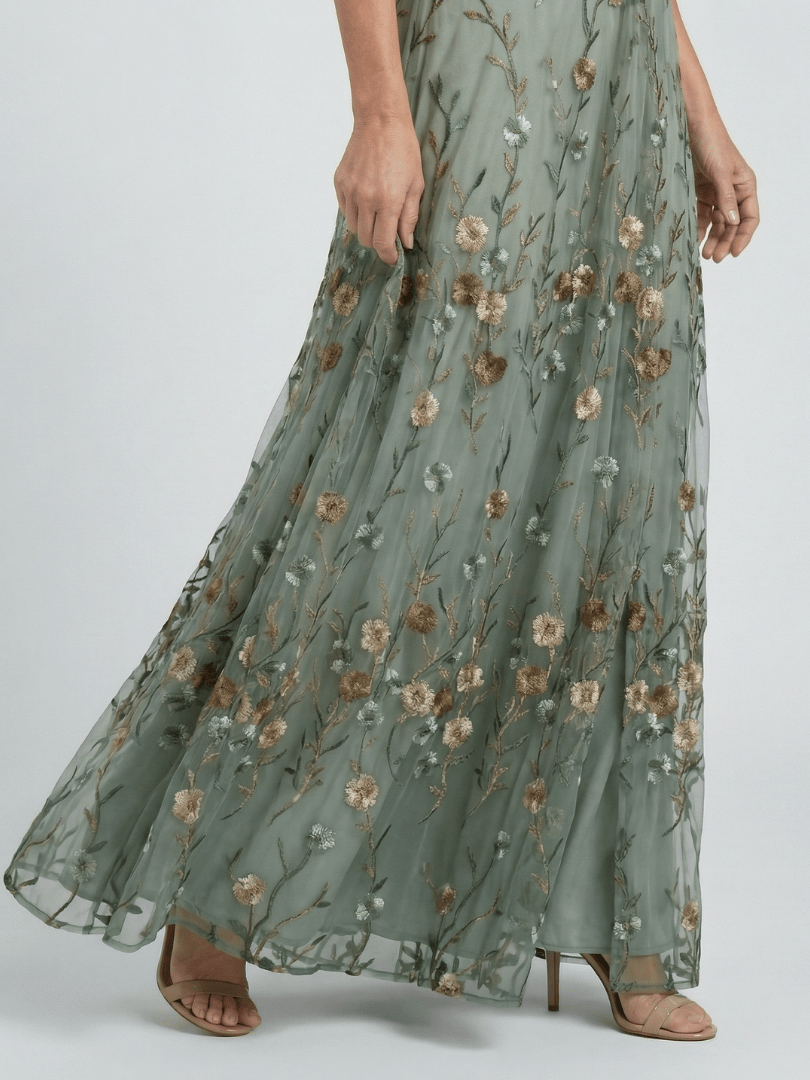 Selora Bloom Flow Maxi Dress by Emma & Rose Cape Town featuring floral patterns and flowing fabric for elegant summer wear.