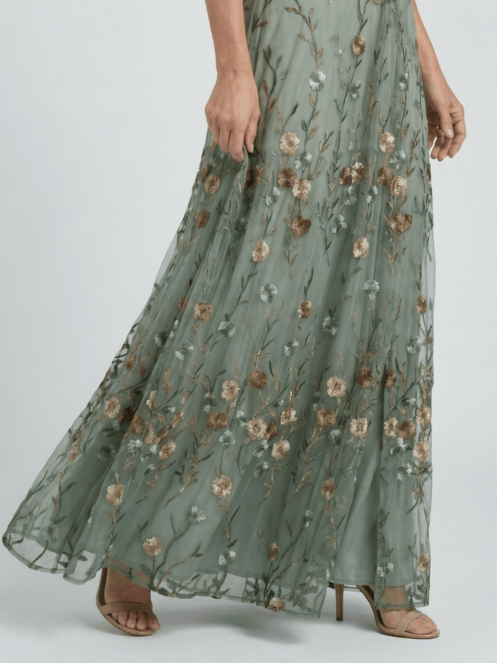 Selora Bloom Flow Maxi Dress by Emma & Rose Cape Town featuring floral patterns and flowing fabric for elegant summer wear.