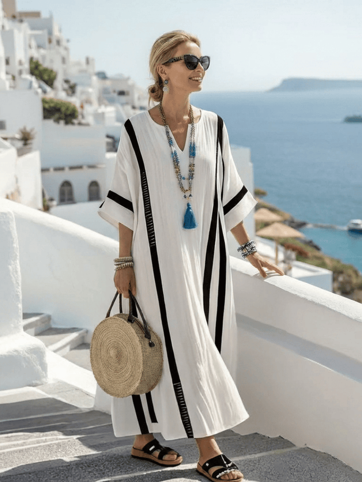 Elvienne™ block striped maxi dress by Emma & Rose Cape Town, featuring a flowing silhouette and bold horizontal stripe pattern.