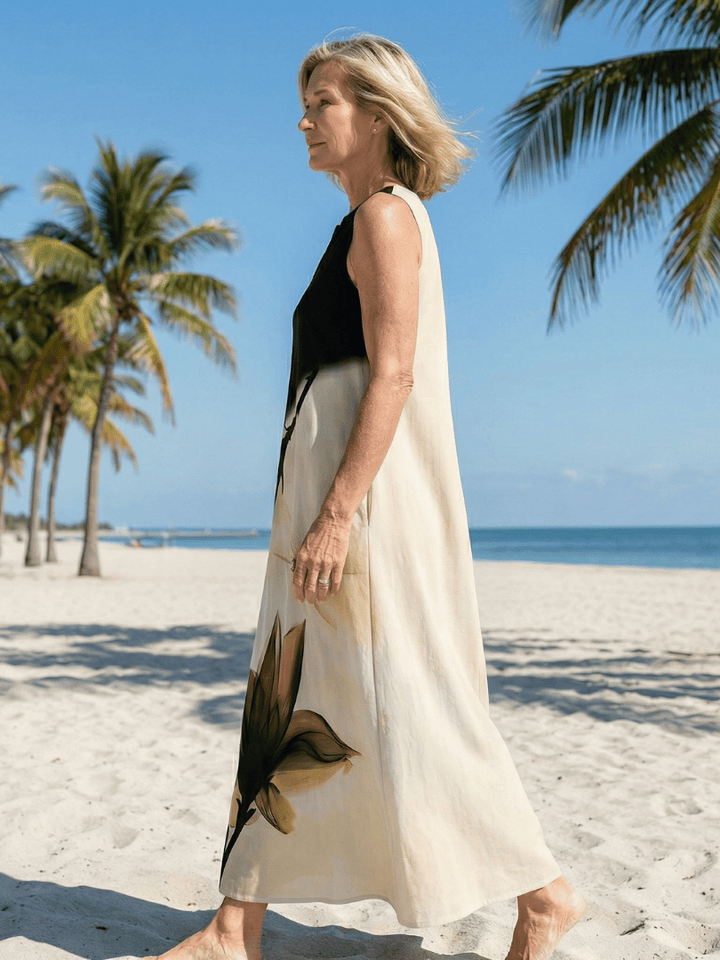 Seraya™ Gentle Fall Maxi Dress by Emma & Rose Cape Town, featuring flowy fabric and seasonal autumn colors.