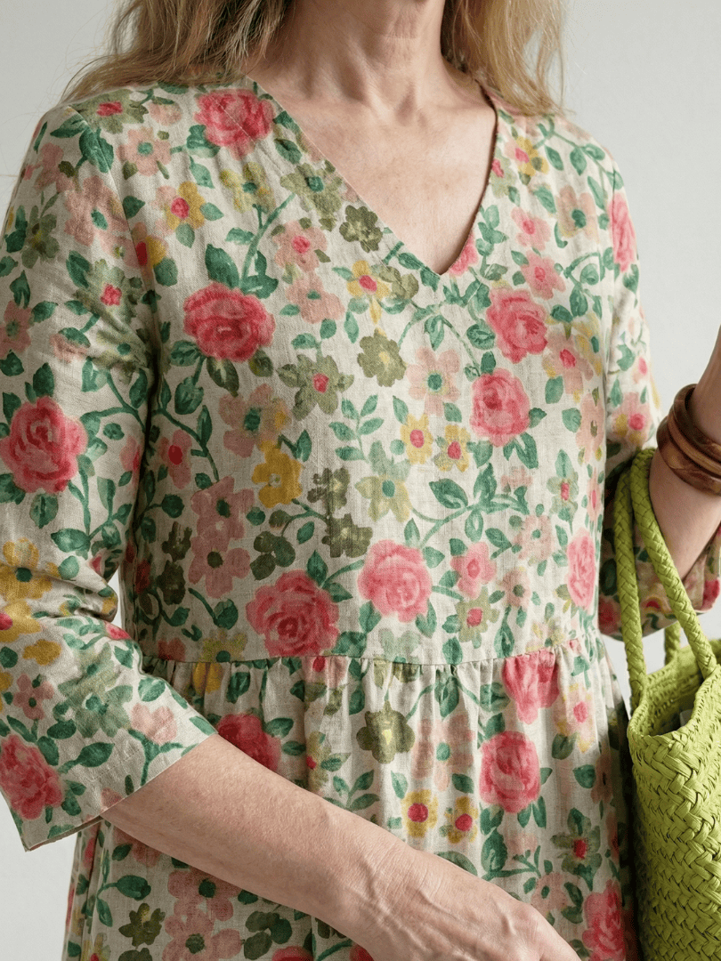 Emma & Rose Cape Town Colin™ Scatter Flower Midi Dress with a floral pattern and midi length, shown in the image.