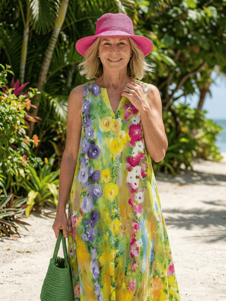 Emma & Rose Cape Town Avira™ Light Flow Maxi Dress with floral pattern and flowing fabric, displayed on a hanger.