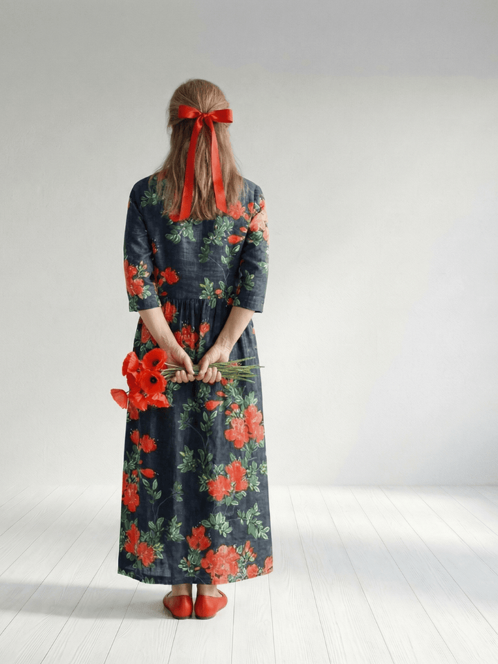 Emma & Rose Cape Town Cyrus™ Drape Floral Midi Dress with flowing fabric and vibrant floral pattern, displayed on a hanger.
