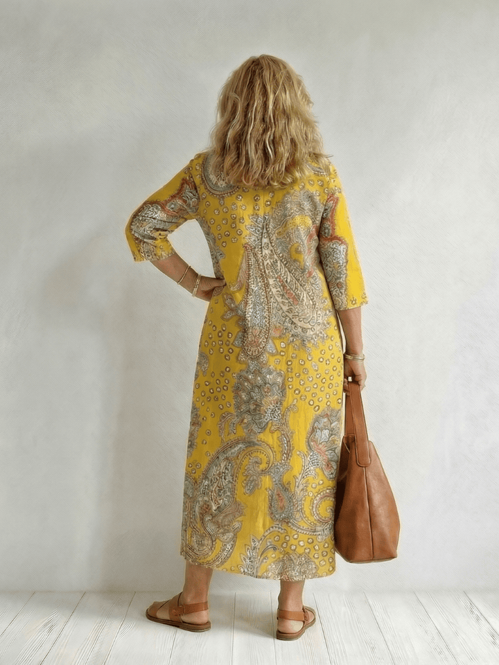 Emma & Rose Cape Town Rowan™ soft paisley midi dress featuring a flowing silhouette and intricate paisley pattern.