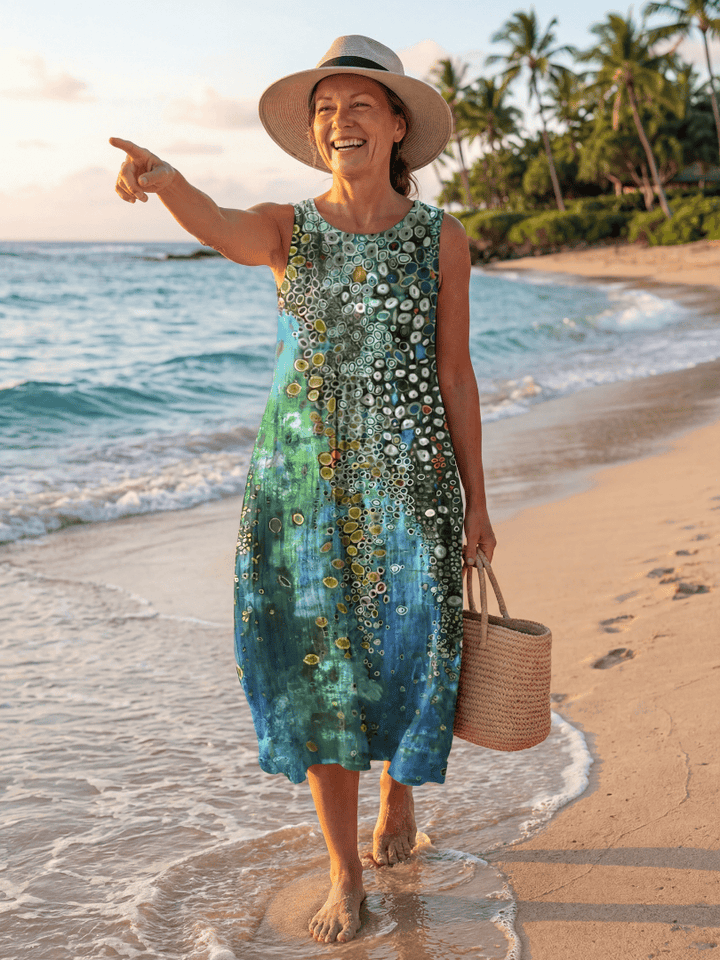 Moana™ Ocean Mosaic Midi Dress by Emma & Rose Cape Town featuring vibrant ocean-inspired print and flowing silhouette.