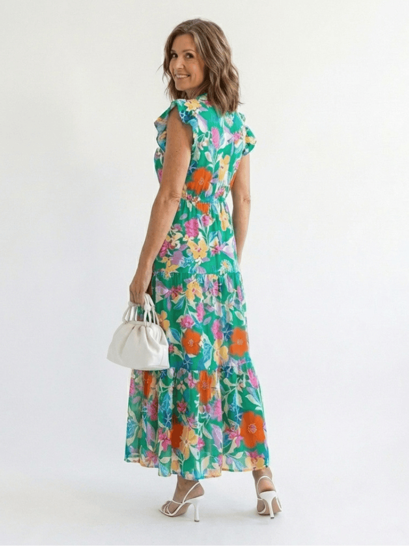 Lila™ V-neck tiered midi dress by Emma & Rose Cape Town, featuring flowing fabric and elegant layered design.