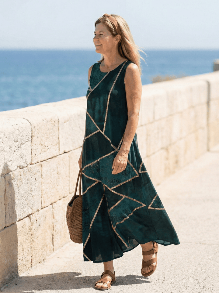 Saelle™ Calm Tide midi dress by Emma & Rose Cape Town, featuring flowing fabric and a relaxed fit, shown on a model.