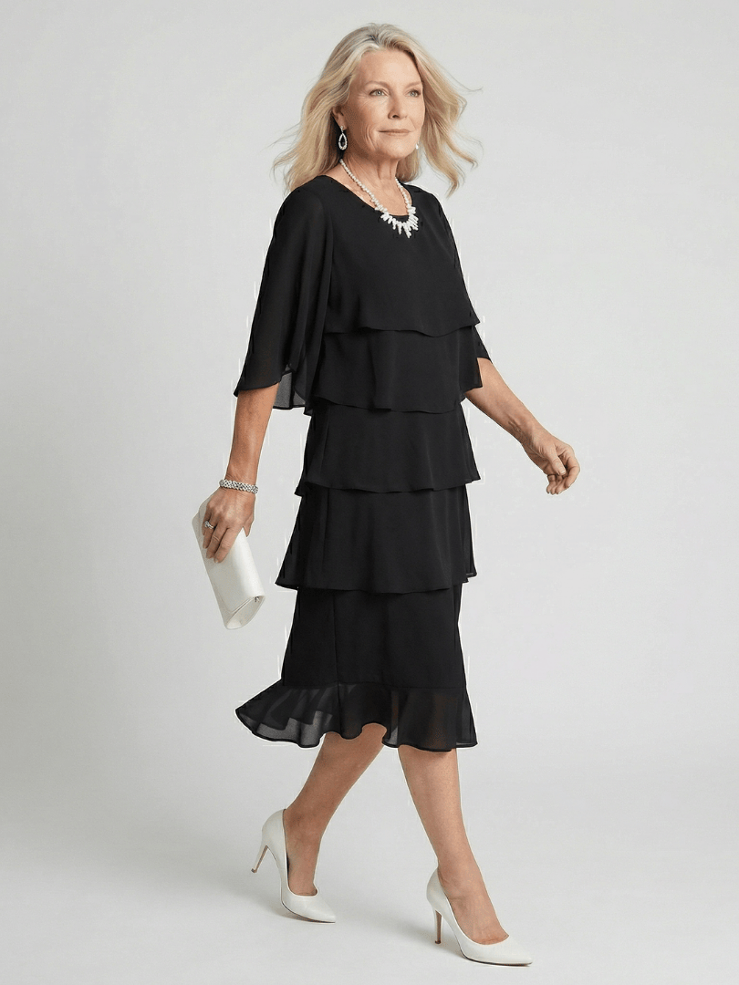 Emma & Rose Cape Town Brent™ layered tier midi dress shown in soft fabric with tiered design and elegant silhouette.