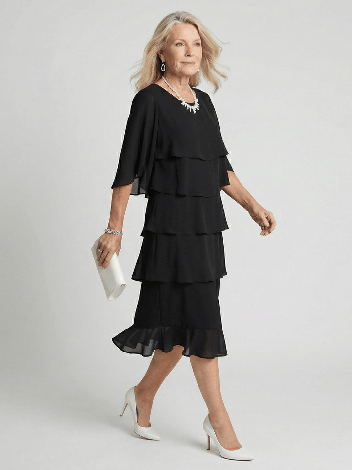 Emma & Rose Cape Town Brent™ layered tier midi dress shown in soft fabric with tiered design and elegant silhouette.