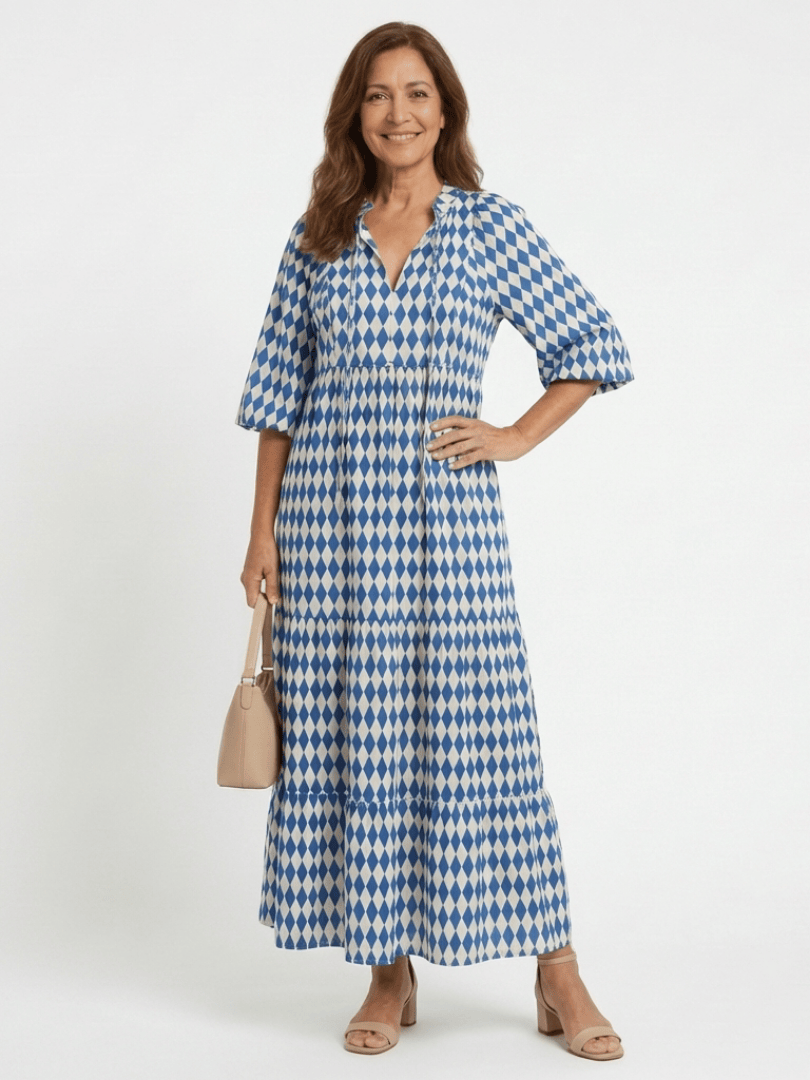 Emma & Rose Cape Town Elodie™ Print Tiered Midi Dress showing a flowing, tiered fabric design with a floral print and sleeveless style.