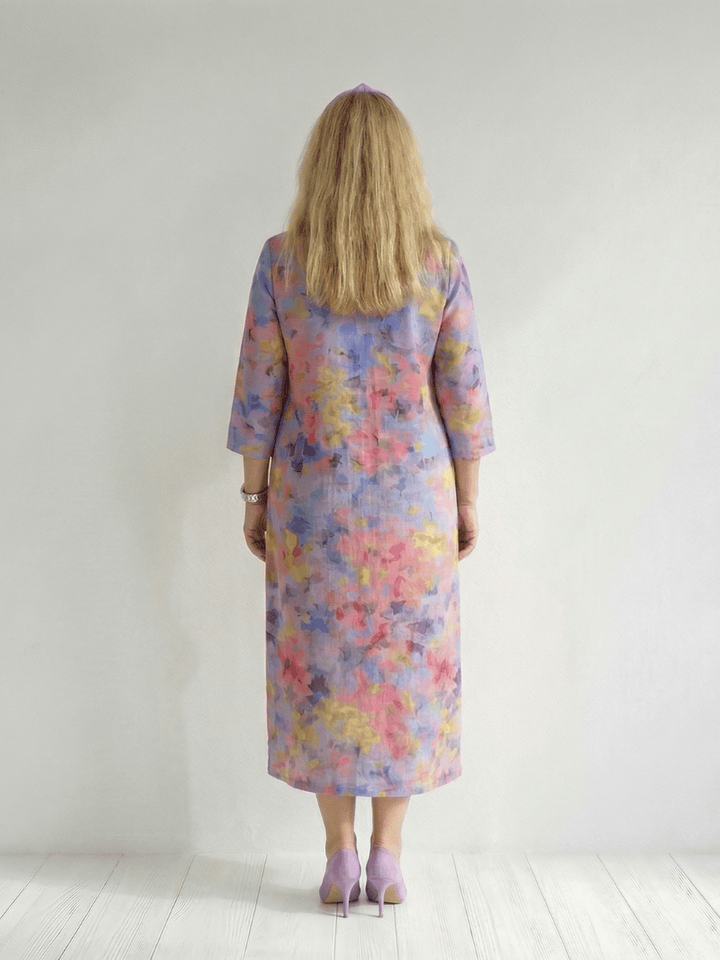 Emma & Rose Cape Town Benson™ abstract floral midi dress featuring a flowy fabric and vibrant floral pattern.