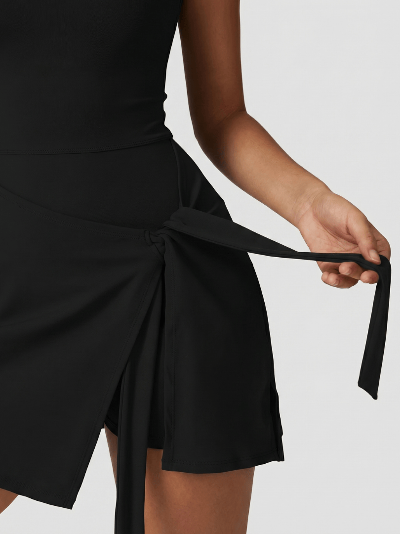 Carys™ sleeveless wrap tennis dress by Emma & Rose Cape Town, shown in a stylish fit with a wrap design and tennis-inspired fabric.