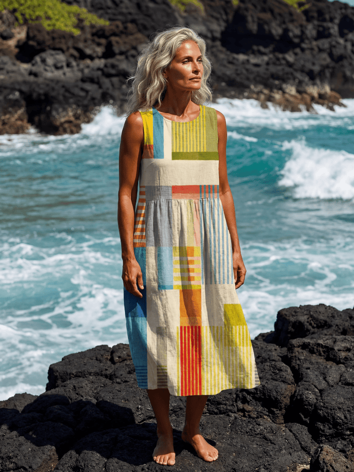 Emma & Rose Cape Town Esme™ Painted Block Midi Dress displayed on a model, showcasing its stylish design and vibrant pattern.