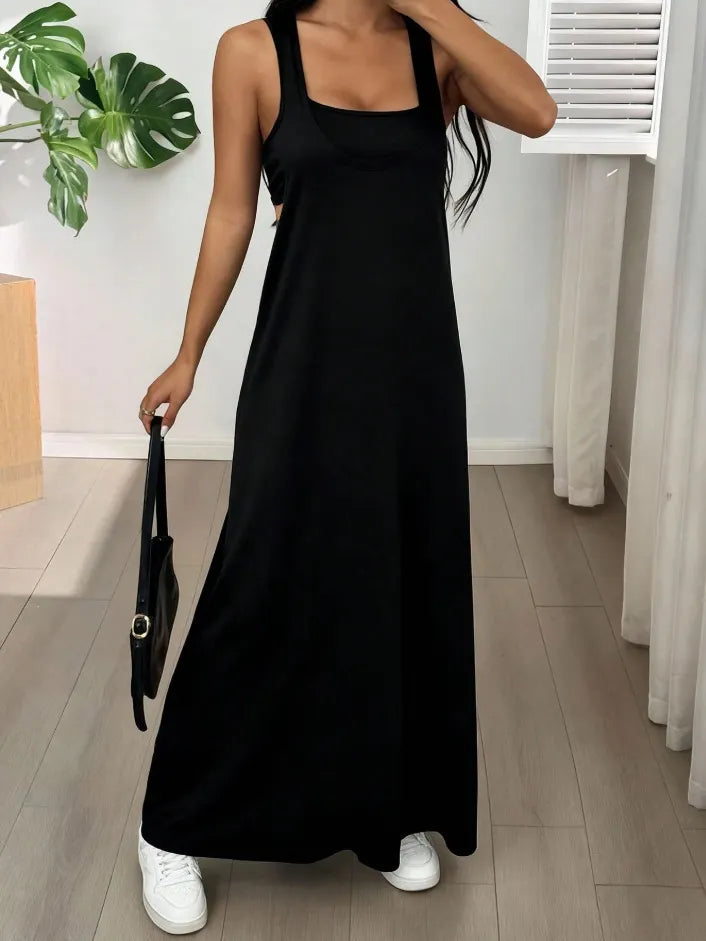 Long women's dress with a two-piece effect and side cutouts