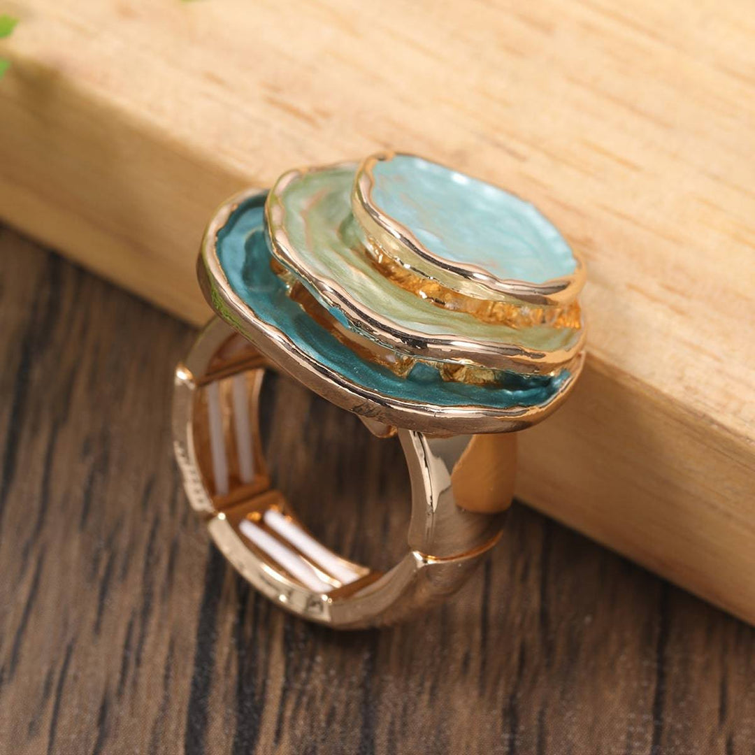 Emma & Rose Cape Town Shana™ Boho triple layer ring featuring intertwined gold bands and textured design on a white background.