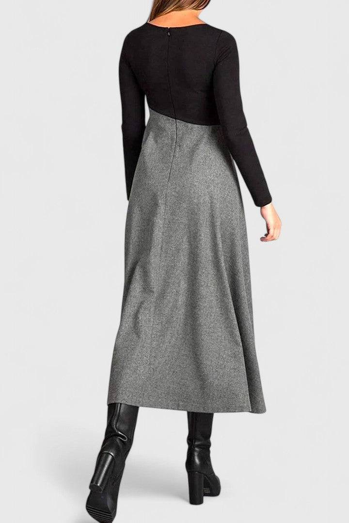 Emma & Rose Cape Town Janet™ long sleeve maxi dress displayed on a model with flowing fabric and a fitted waist.