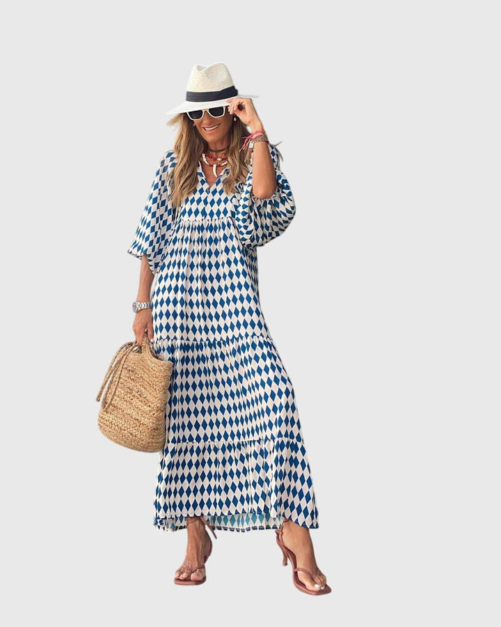 Sarah™ Boho Maxi Dress by Emma & Rose Cape Town, flowing fabric and bohemian style, shown in a vibrant, patterned design.