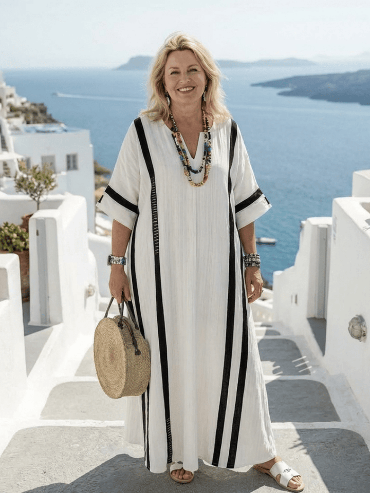 Elvienne™ block striped maxi dress by Emma & Rose Cape Town, featuring a flowing fabric and bold horizontal stripes.