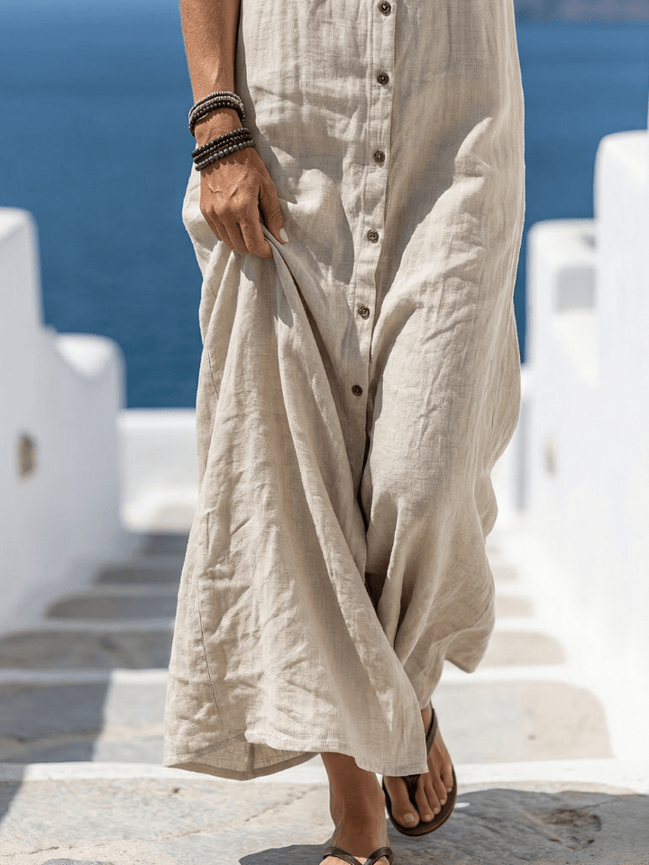Marune™ front hooded maxi dress by Emma & Rose Cape Town, showing the flowing fabric and hood detail on a model.