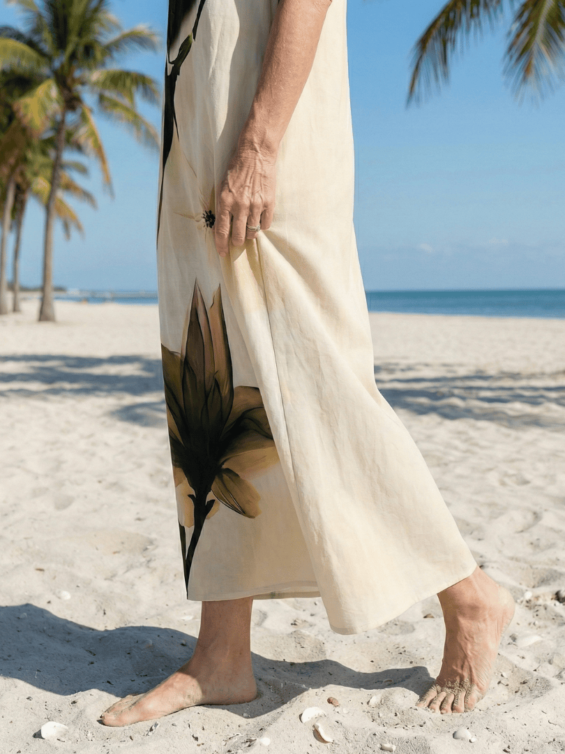 Seraya™ Gentle Fall Maxi Dress by Emma & Rose Cape Town featuring a flowing fabric and elegant design in warm fall colors.