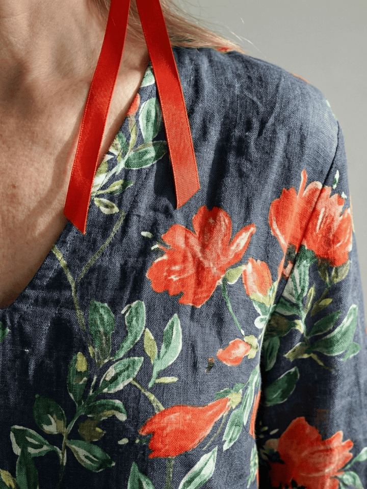 Cyrus™ Drape Floral Midi Dress by Emma & Rose Cape Town featuring a flowing silhouette and vibrant floral pattern.