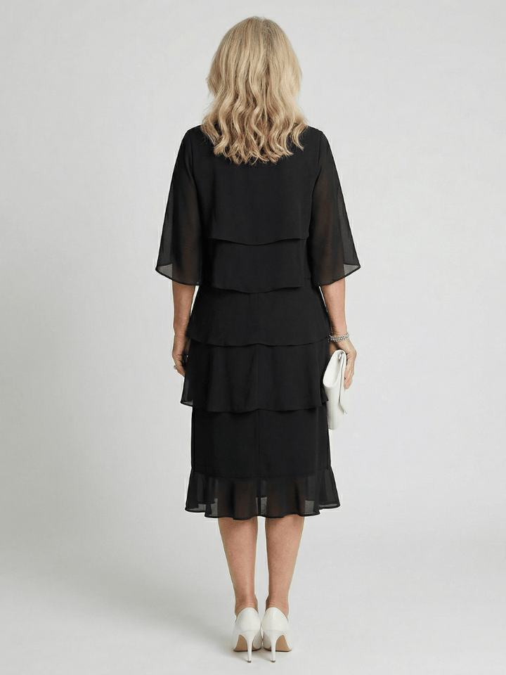 Emma & Rose Cape Town Brent™ layered tier midi dress with flowing fabric and stylish tiered design, perfect for elegant occasions.