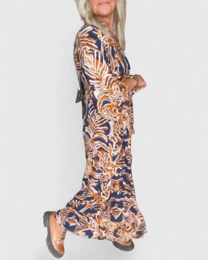 Emma & Rose Cape Town Julee™ sophisticated maxi dress featuring a flowing, elegant design and detailed fabric texture.