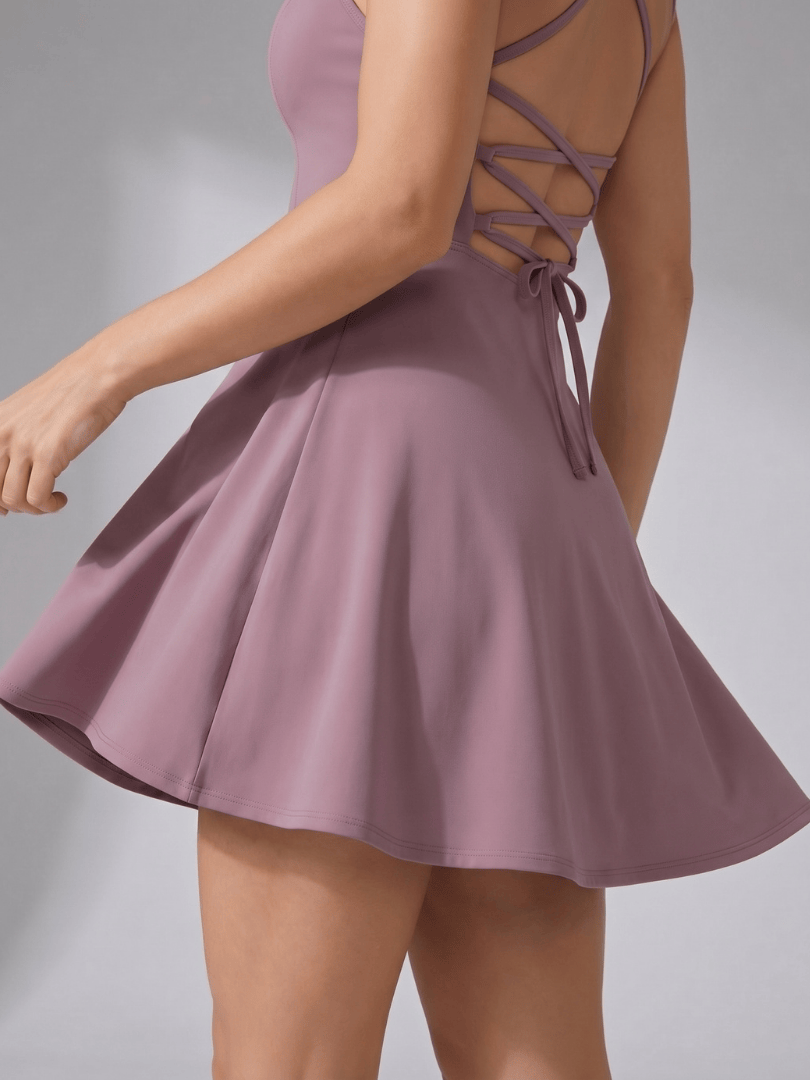 Emma & Rose Cape Town Quinn™ neck flared tennis dress shown in image with stylish design and sporty fit.