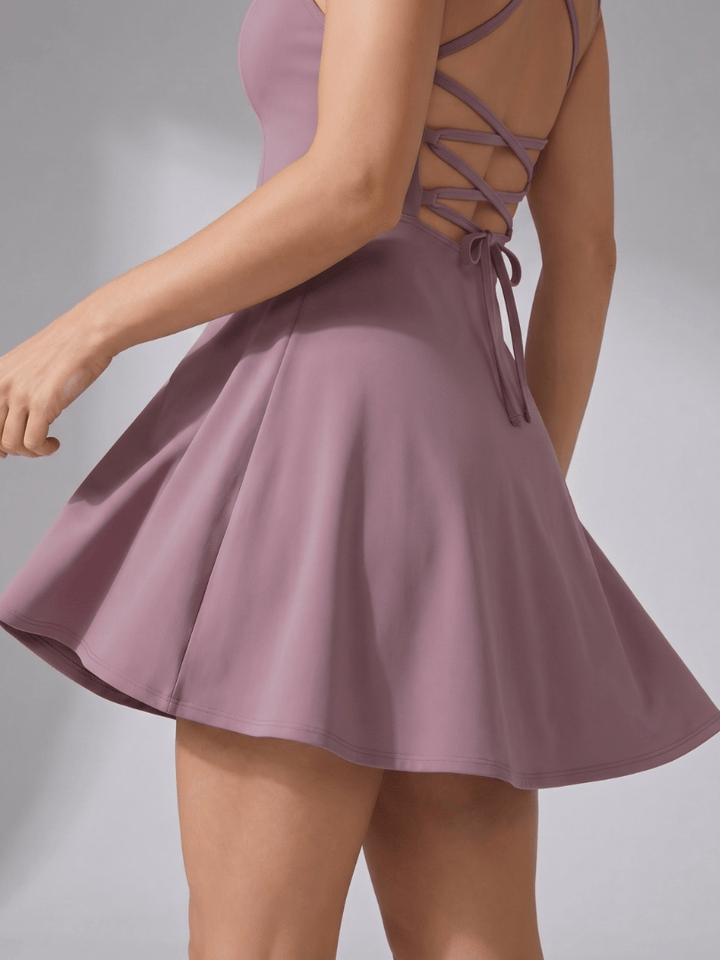Emma & Rose Cape Town Quinn™ neck flared tennis dress shown in image with stylish design and sporty fit.