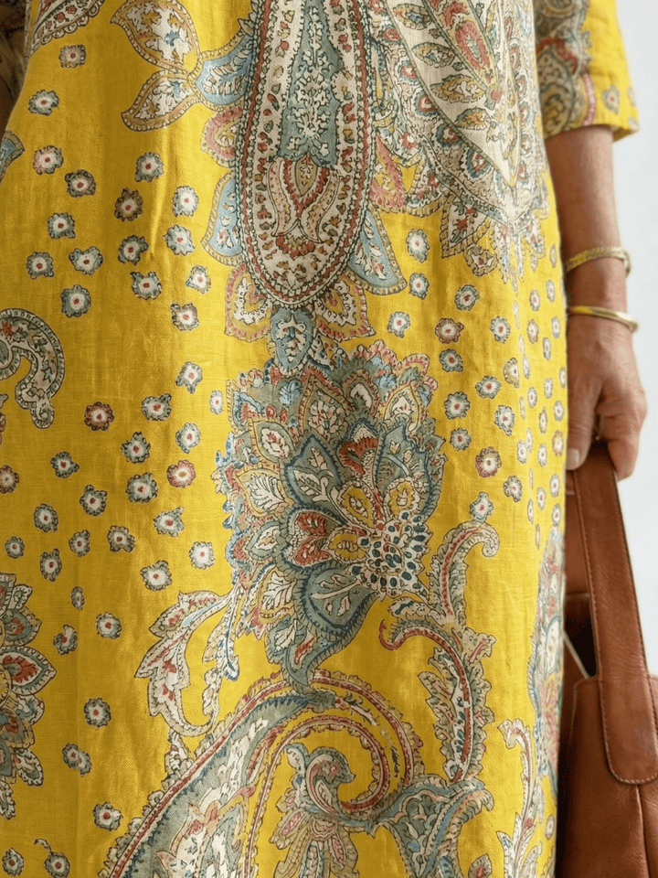 Emma & Rose Cape Town Rowan™ Soft Paisley Midi Dress featuring a flowing silhouette and intricate paisley pattern.