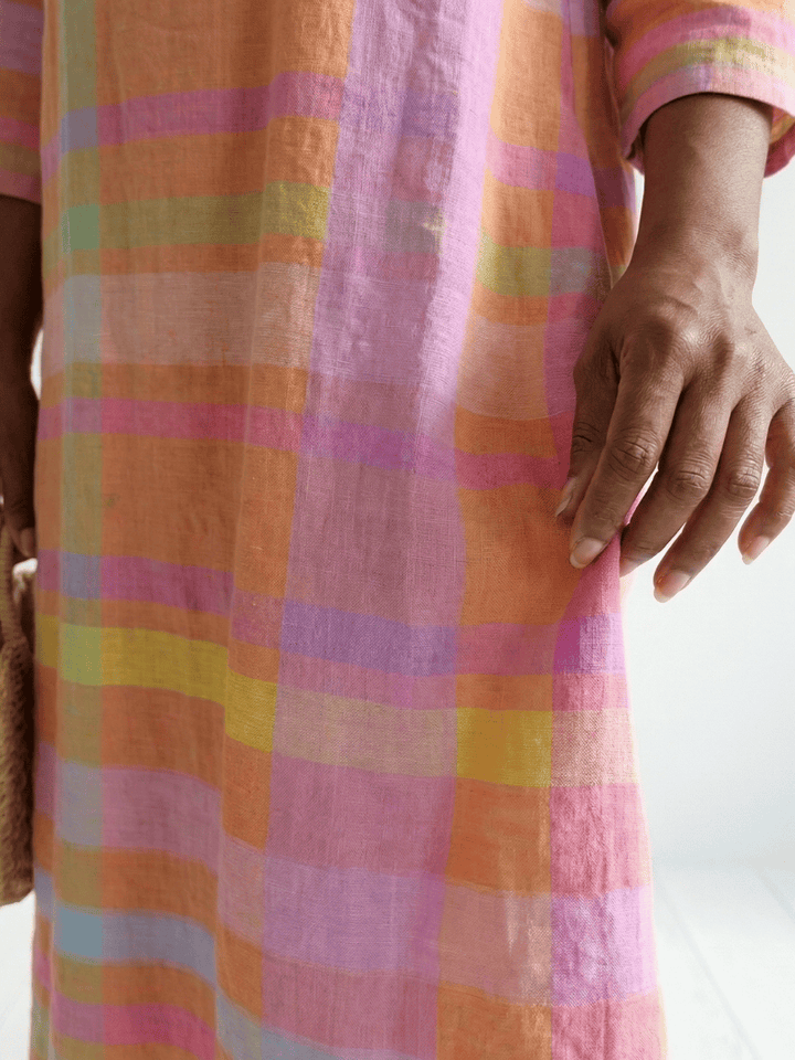 Tessa™ Drape Stripe Midi Dress by Emma & Rose Cape Town showing its flowing fabric and stylish drape in a striped pattern.