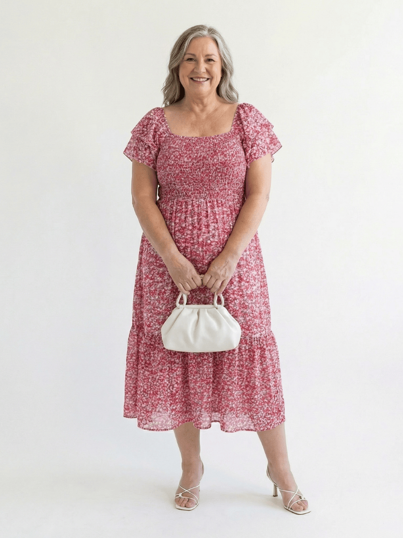 Odette Floral Smocked Midi Dress by Emma & Rose Cape Town, showcasing a feminine midi dress with floral pattern and smocked bodice.