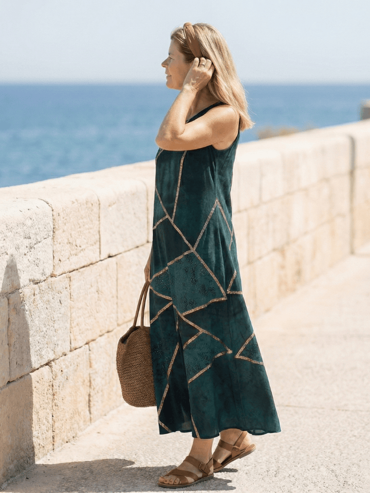 Saelle™ Calm Tide Midi Dress by Emma & Rose Cape Town, shown in soft fabric with flowing silhouette and subtle pattern.