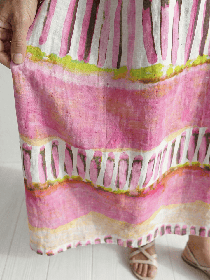 Calla™ Easy Flow Patterned Dress by Emma & Rose Cape Town, featuring a flowing fabric with vibrant floral patterns.