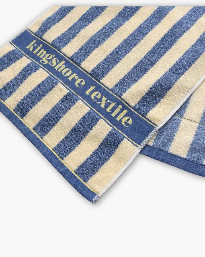 Emma & Rose Manhattan Lance™ Sea Stripe Hand Towel with blue and white nautical pattern on soft, absorbent fabric.