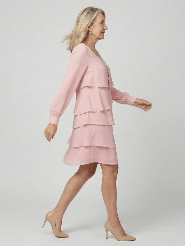 Emma & Rose Cape Town Kirax™ layered knee-length dress shown in soft fabric with layered design and knee-length cut.