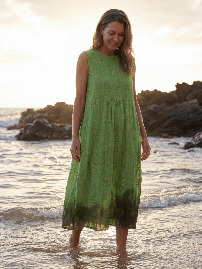 Kapua™ Garden Texture Midi Dress by Emma & Rose Cape Town, showing the floral patterned fabric and flowing silhouette.