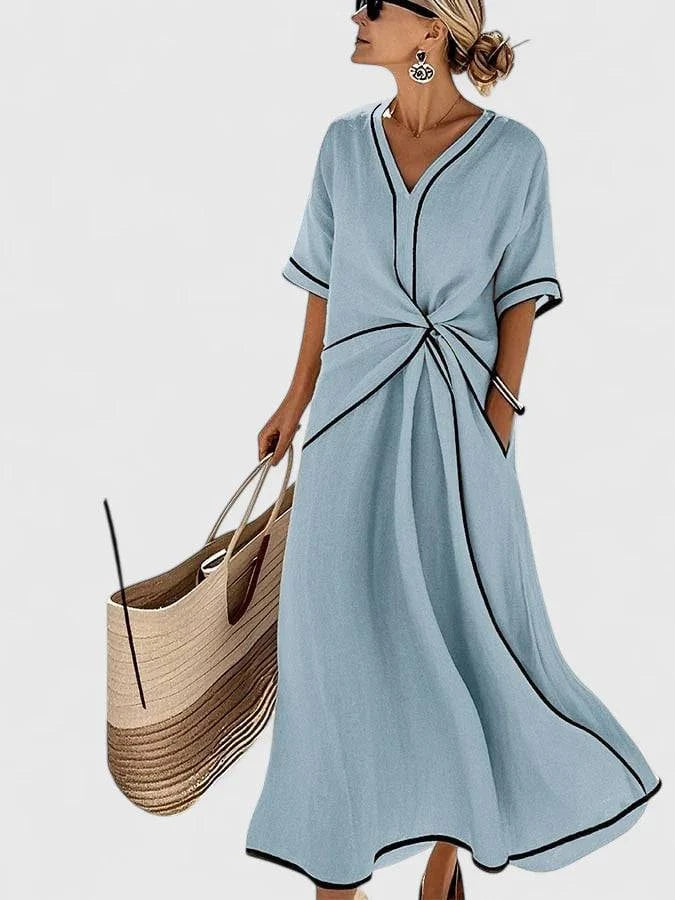 Elegant Emma & Rose Cape Town Erykahhh™ dress with a stylish, flowing design and intricate detailing, perfect for formal occasions.