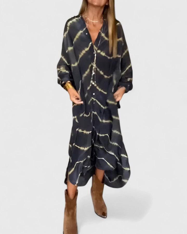Amelie™ boho striped maxi dress by Emma & Rose Cape Town, featuring a flowing silhouette and vibrant striped pattern.