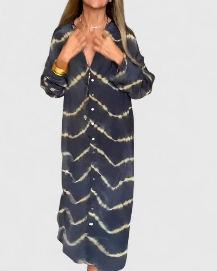 Emma & Rose Cape Town Amelie™ boho striped maxi dress displayed on a hanger in natural light.