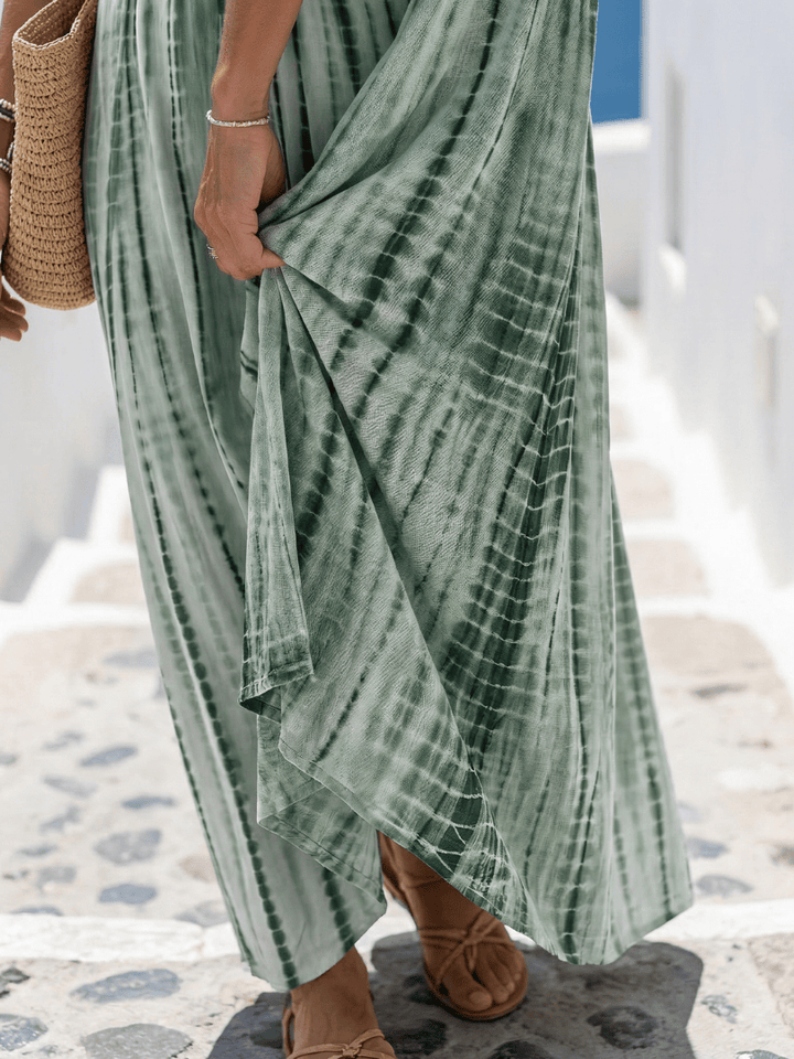 Emma & Rose Cape Town Karys™ soft dye midi dress with flowing fabric and elegant design, shown on a model.